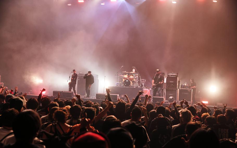Pennywise performs during a concert.