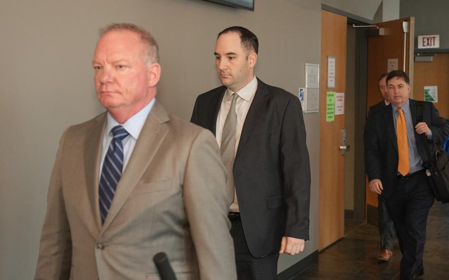 Army Sgt. Daniel Perry, right, and his attorney Doug O’Connell walk out of the courtroom during jury deliberations Friday, April 7, 2023, in his trial in the shooting death of Garrett Foster, an Air Force veteran. The Army has begun the process to discharge Perry after a jury found him guilty of murder.