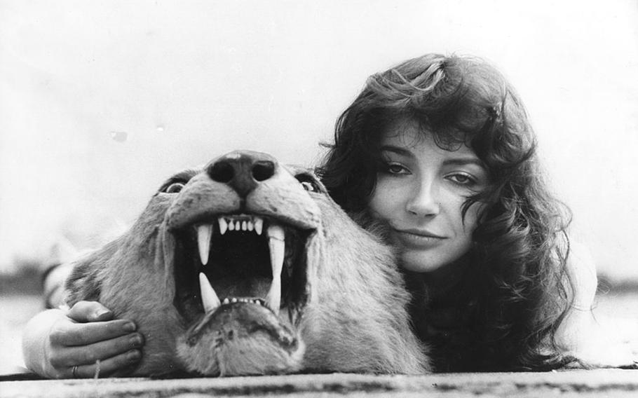 English singer-songwriter and musician Kate Bush poses on a lionskin rug at her family’s home in East Wickham, London, in 1978. Bush has performances scheduled in the United Kingdom in late September and October.