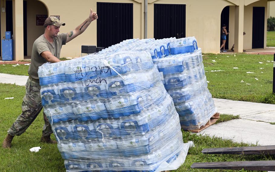 In the aftermath of Typhoon Mawar, members of the 36th Force Support Squadron unload cases of water for distribution at Andersen Air Force Base, Guam, Friday, May 26, 2023.