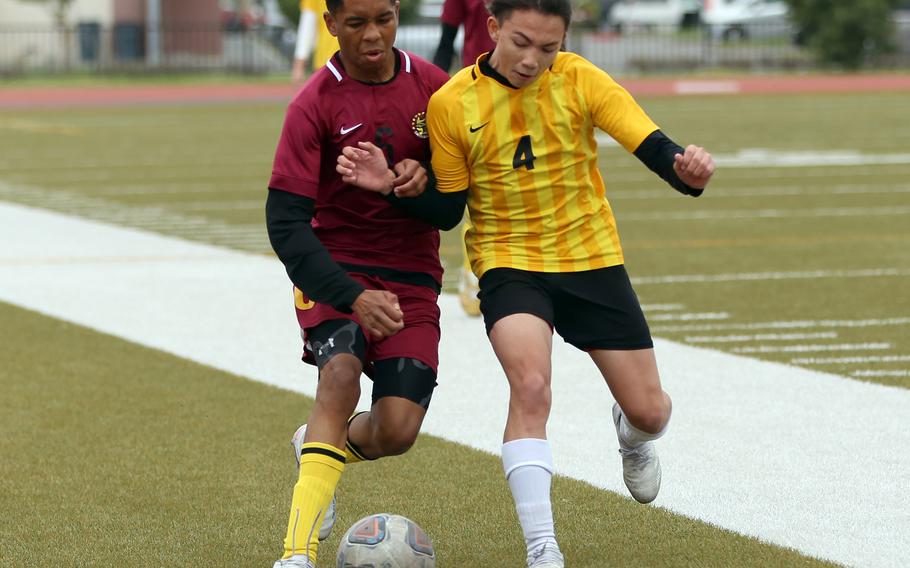 Matthew C. Perry's Nemo Hinds and Robert D. Edgren's Haruki Jones battle for the ball during Monday's Division II boys soccer match. The Samurai won 2-0.