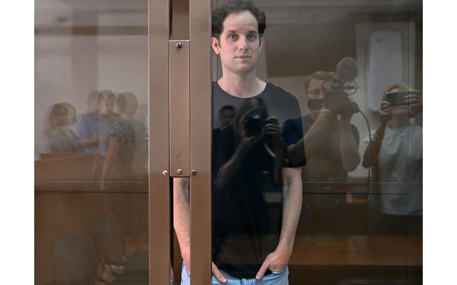 U.S. journalist Evan Gershkovich, arrested on espionage charges, stands inside a defendants’ cage before a hearing to consider an appeal on his extended detention at The Moscow City Court in Moscow on June 22, 2023. 