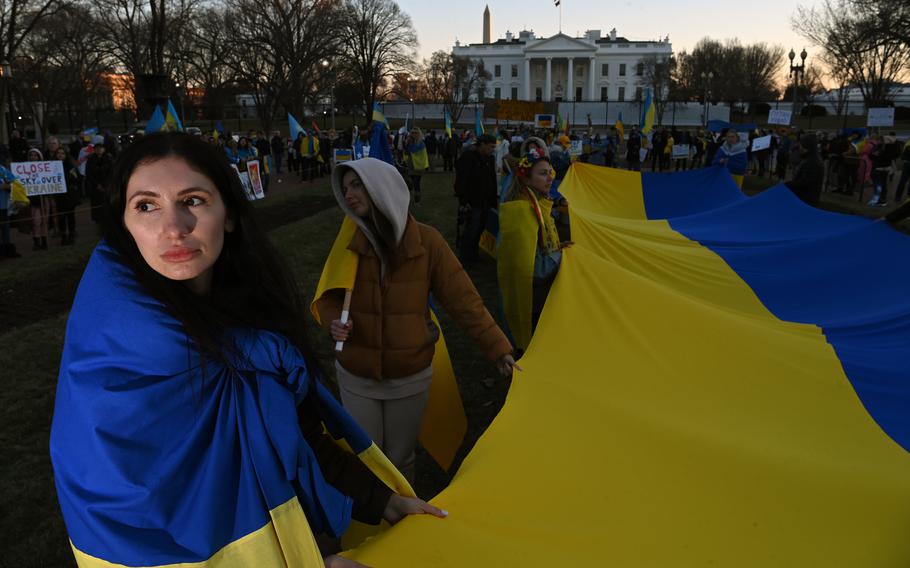 Iryna Tomaieva, left, gathers with others to show their support for Ukraine near the White House on Feb. 27, 2022. 