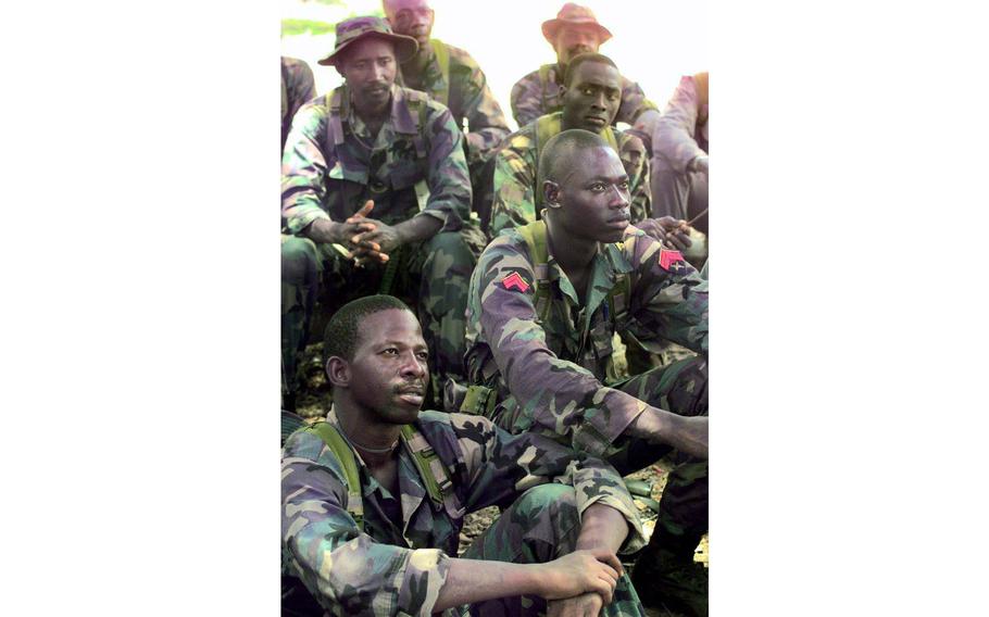 Dressed in uniforms given to them by the U.S. Army, Senegalese soldiers listen to classes given by U.S. Green Berets.