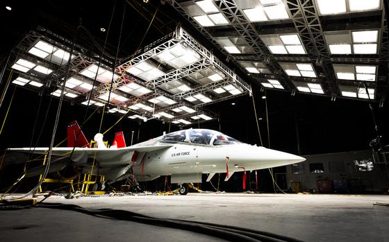 A  T-7A Red Hawk sits under bright lights used to create heat in the McKinley Climatic Lab March 19 at Eglin Air Force Base, Florida. The Air Force’s newest training aircraft experienced temperature extremes from 110 to minus 25 degrees Fahrenheit as well as heavy humidity during the month of testing. The tests evaluate how the aircraft, its instrumentation and electronics fared under the extreme conditions it will face in the operational Air Force. (U.S. Air Force photo by Samuel King Jr.)