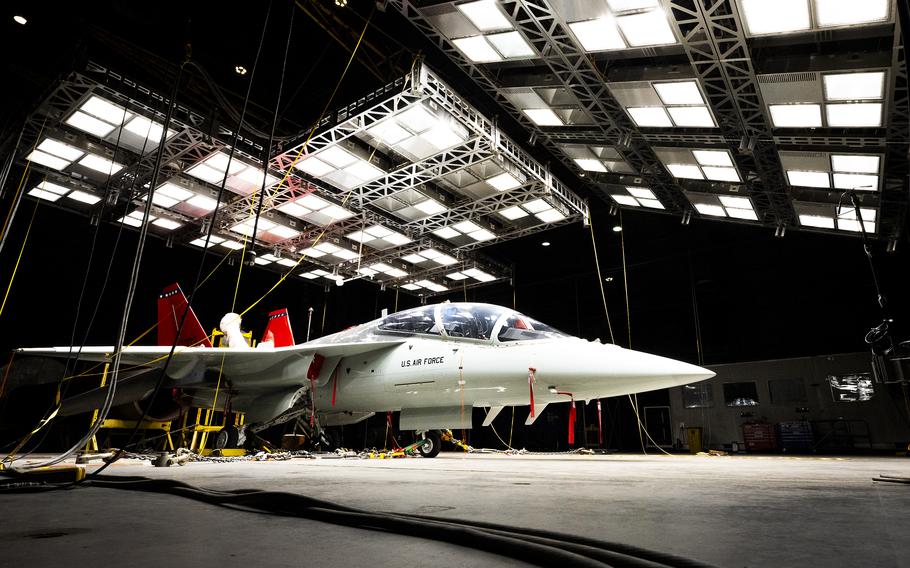 A  T-7A Red Hawk sits under bright lights used to create heat in the McKinley Climatic Lab at Eglin Air Force Base, Fla. The Air Force’s newest training aircraft experienced temperature extremes from 110 degrees to minus 25 degrees Fahrenheit as well as heavy humidity during the month of testing. The tests evaluate how the aircraft, its instrumentation and electronics fared under the extreme conditions it will face in the operational Air Force.