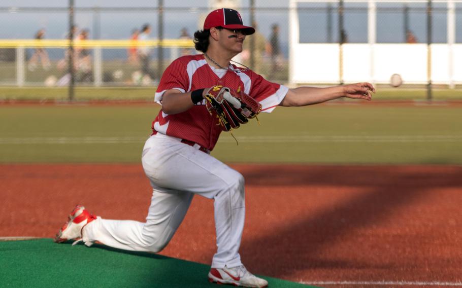 Dal McNamara throws to home.