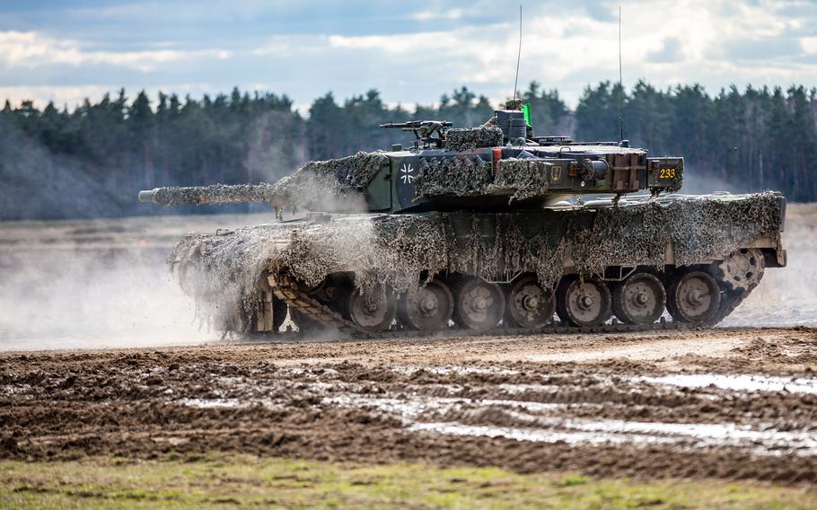 A German Leopard 2A6 tank drives onto the range during a combined arms exercise in Bemowo Piskie, Poland, April 3, 2023. NATO ramped up defense spending in 2023 as more members hit a key fiscal target, NATO Secretary-General Jens Stoltenberg said July 7, 2023.