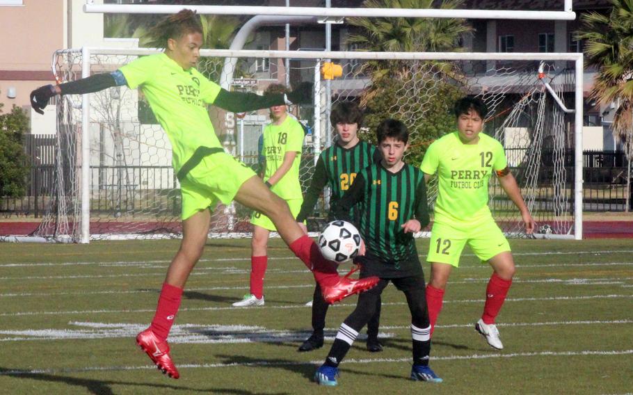 Matthew C. Perry's Billy Hill goes up to get the ball against Robert D. Edgren during Friday's Perry Cup boys soccer match. The Samurai won 3-0.