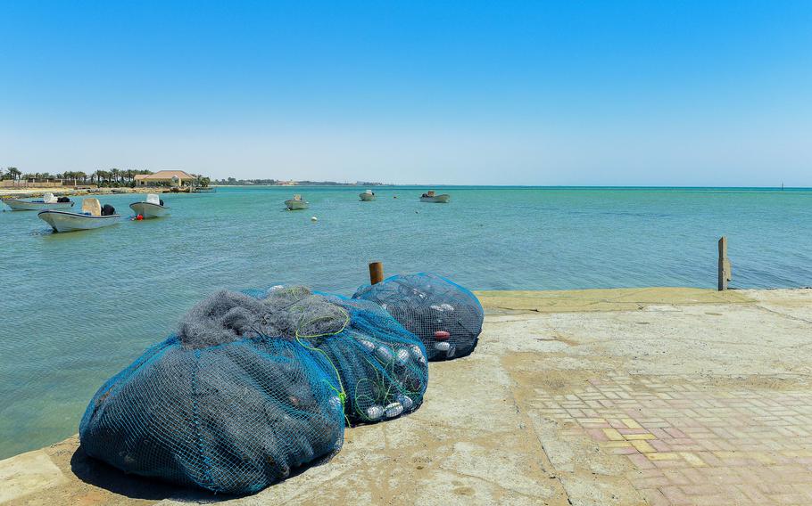 Fishing nets sit on a pier