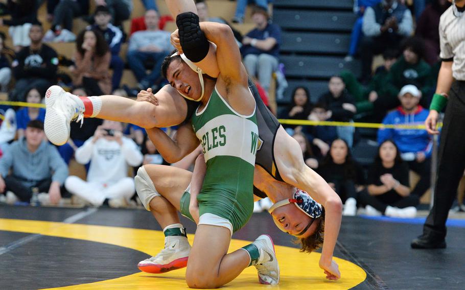 Naples’ Ivan Villescas seems to have the upper hand against Vicenza’s Mitchell Horrigan, but Horrigan escaped and went on to win the 120-pound match at the DODEA-Europe wrestling finals in Wiesbaden, Germany, Feb. 10, 2024.