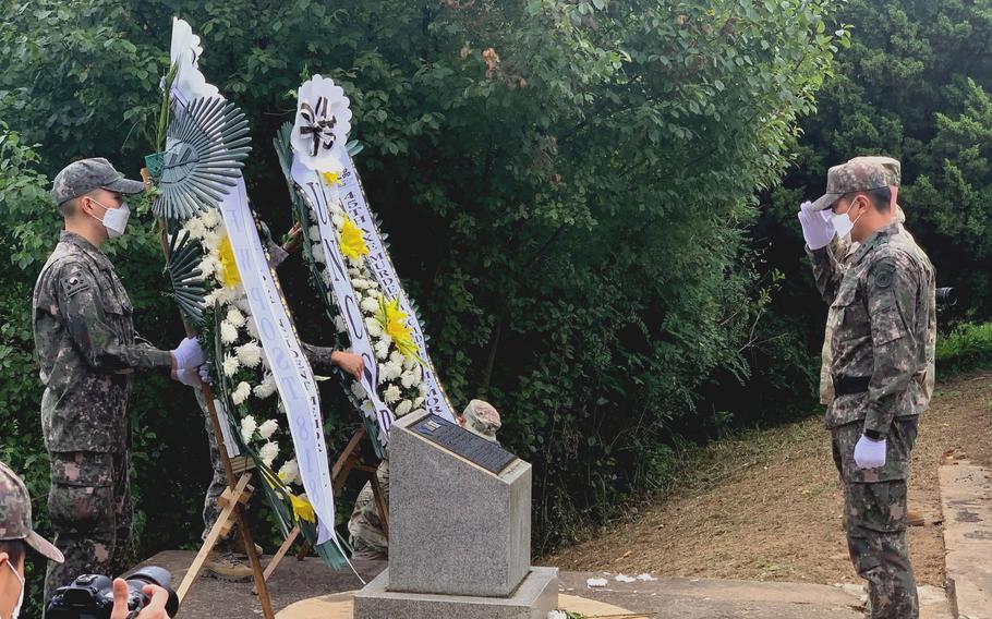 Troops of U.N. Command render salutes during a ceremony on the South Korean side of the Demilitarized Zone on Aug. 18, 2021, marking 45 years since the killing of two U.S. officers at the site.