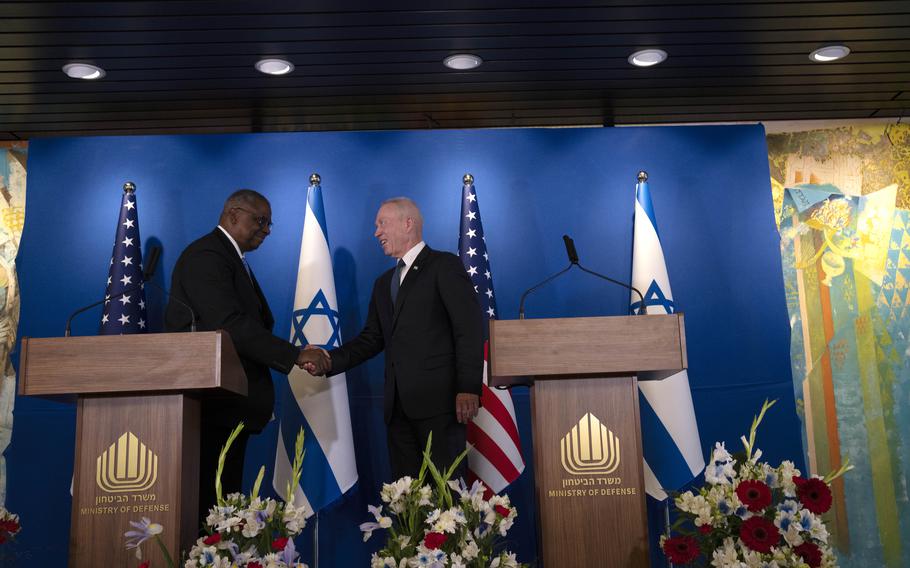 U.S. Secretary of Defense Lloyd Austin, left, shakes hands with his Israeli counterpart, Minister of Defence Yoav Gallant at a joint statement following their meeting at Ben Gurion International Airport in Thursday, March 9, 2023. 