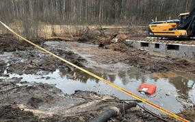 Lithuanian engineers and U.S. soldiers pump water from a swamp in an effort to recover a U.S. Army M88 Hercules armored vehicle near Pabrade, Lithuania, March 27, 2025.