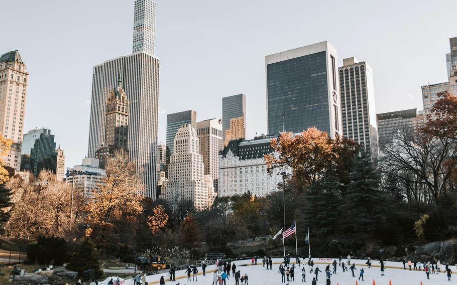 People ice skate at a park in New York City on Nov 23, 2018. A list of the most expensive cities in which to live, compiled semiannually by the London-based Economist Intelligence Unit as part of a Worldwide Cost of Living survey, saw drastic changes this year, in particular as an apparent result of ripple effects of the war in Ukraine.