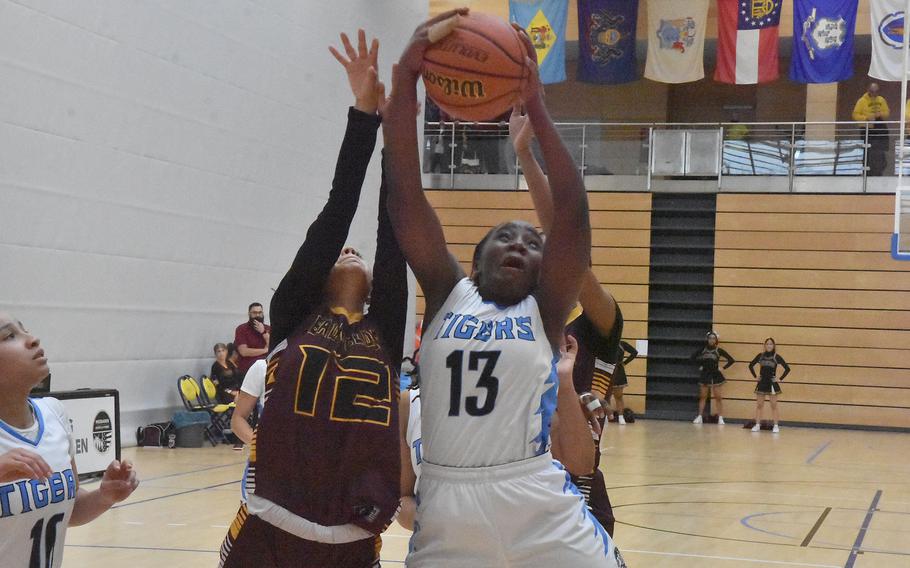 Angelaurie Owens and Emily Ramirez fight for the ball.