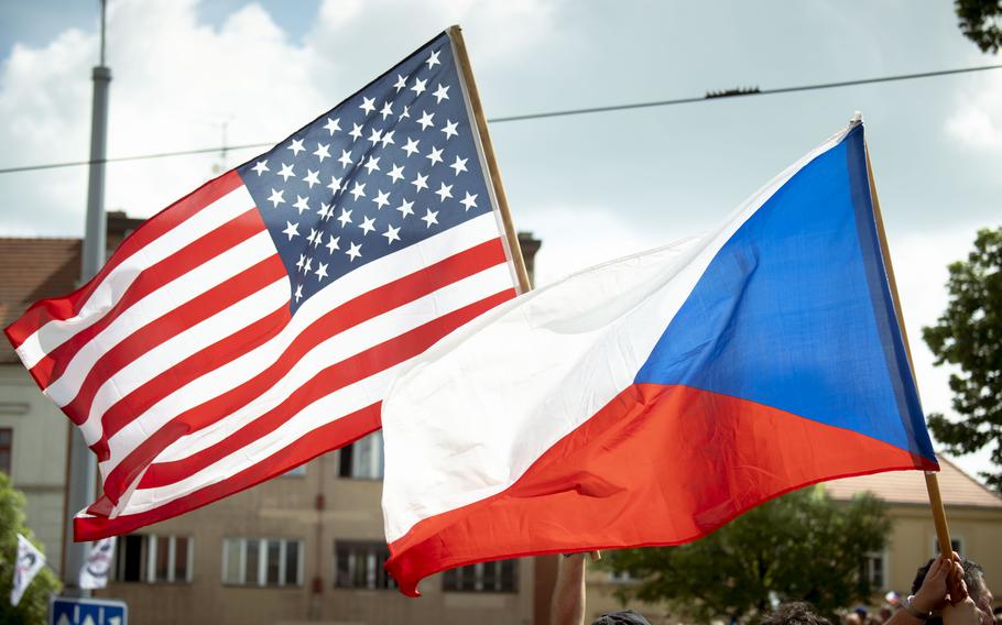 The flags fly during the ceremony.