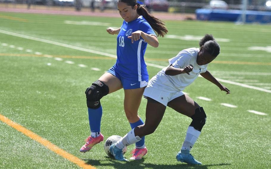 Ramstein's Nayla McLeish and Wiesbaden's Maira Valdez clash Monday, May 19, 2025, at the DODEA-Europe Division I girls soccer championships at Ramstein Air Base, Germany.