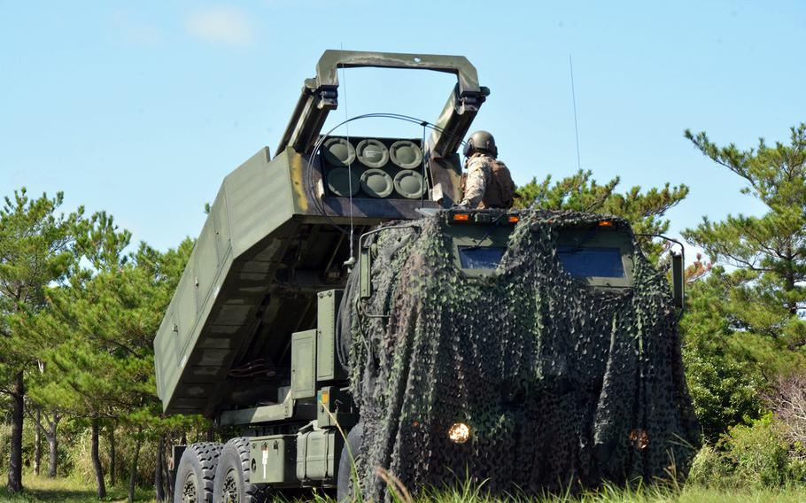 A member of 3rd Battalion, 12th Marine Regiment readies an M142 High Mobility Artillery Rocket System, or HIMARS, during the Noble Jaguar exercise at Central Training Area, Okinawa, Thursday, Sept. 30, 2021.