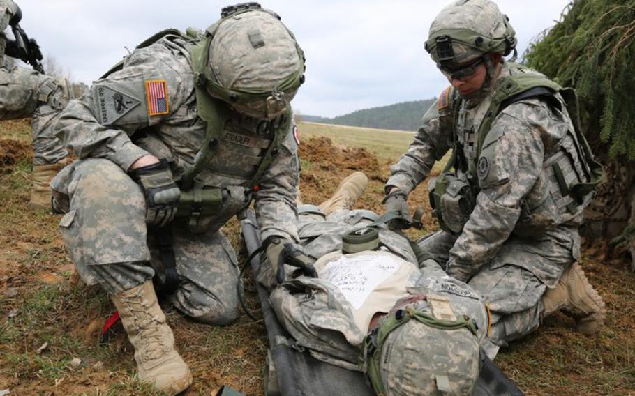 Soldiers assigned to Bravo Troop, 1st Squadron, 2nd Cavalry Division strap a soldier with a simulated injury to a litter during an exercise in Hohenfels, Germany, April 12, 2015. StatBond, a gel developed with military funding, may allow medics to stop arterial bleeding without the need for compression, Army Research Laboratory officials said May 4, 2021.