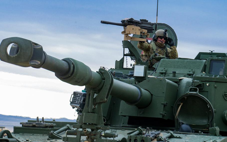 A soldier with the Army’s 1st Battalion, 9th Field Artillery Regiment of the 3rd Infantry Division’s 2nd Armored Brigade Combat Team is pictured in his M109A7 Paladin howitzer during a force-on-force fight at the National Training Center at Fort Irwin, Calif., Feb. 27, 2023.