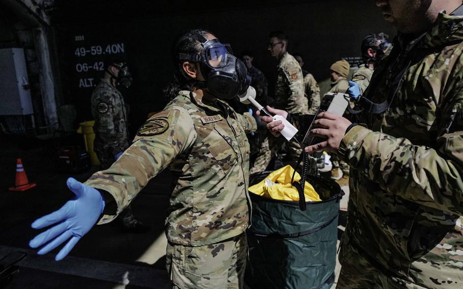 Staff Sgt. Christopher Richardson, right, inspects Tech. Sgt. Kayla Bradford with an ADM-300 survey meter, a crucial step in assessing her exposure to simulated radiological elements, during exercise Radiant Falcon on April 24, 2024, at Spangdahlem Air Base, Germany. The Kremlin announced Monday that it will conduct nuclear weapons drills, but Pentagon officials dismissed the idea of an elevated threat. 