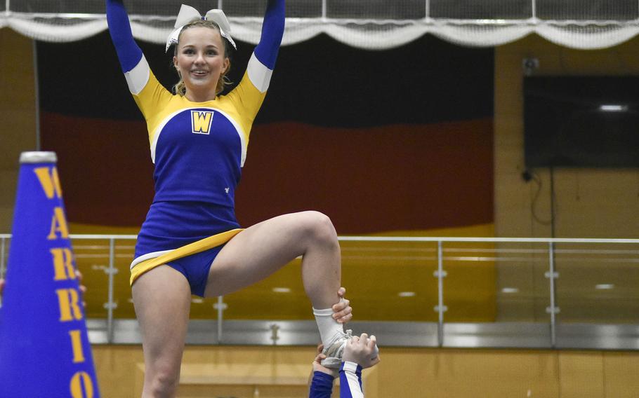 Reese Wilson displays Wiesbaden’s gold school color during the during the 2024 DODEA-Europe Cheerleading Championships in Wiesbaden, Germany on Friday, Feb. 16, 2024. Wilson has cheered on the Warriors team for each of their last three championships.