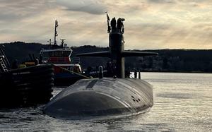 Tugboats guide the attack submarine USS Newport News away from the pier at Naval Submarine Base New London in Groton, Conn., March 12, 2025. Newport News made a port call in Iceland on July 9, marking the first time a nuclear-powered submarine has visited Icelandic shores, the Navy said.
