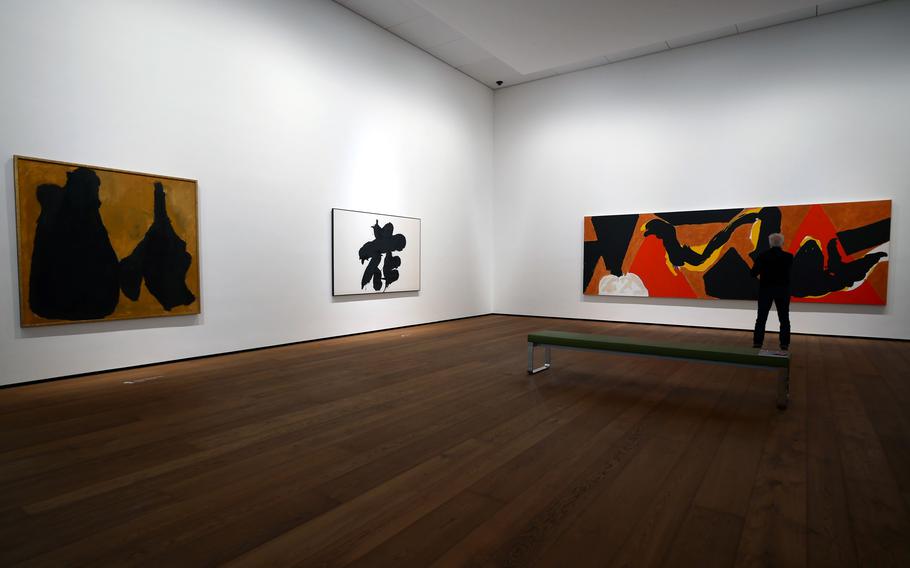 A visitor looks at art at a museum in Wiesbaden, Germany.