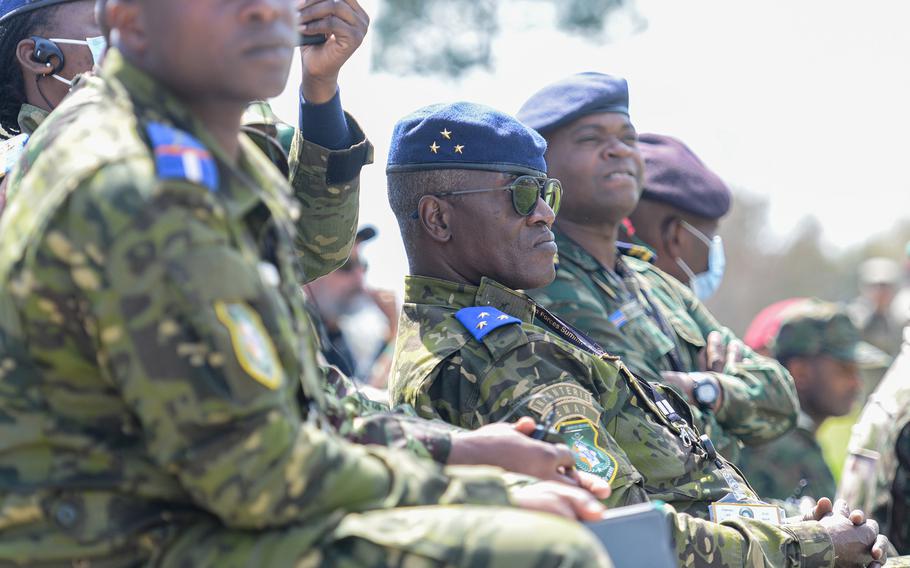 Division Gen. Aly Justin Dem, the chief of staff of the Ivory Coast Army, center, watches a U.S. Army Airborne School demonstration at Fort Benning, Ga., on March 22, 2022, during the U.S. Army’s African Land Forces Summit.