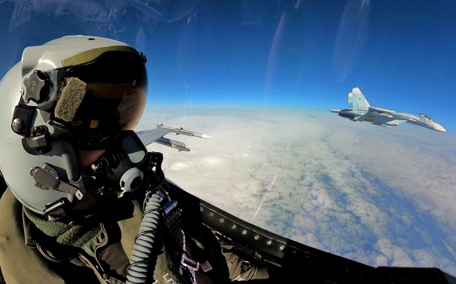 A Romanian air force F-16 intercepts a Russian fighter jet flying in international airspace above the Baltic Sea near NATO territory in April 2023. On Friday, NATO said it had scrambled fighter planes more than 300 times this year to intercept Russian military aircraft flying near the airspace of member countries.