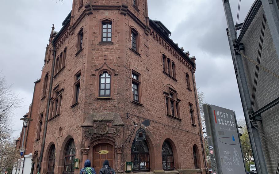 Passersby eye Nora Restaurant, in downtown Kaiserslautern, April 1, 2022. The little eatery specializes in flammkuche but is now known by a new name, though it has long been a favorite of some Americans in the area. 