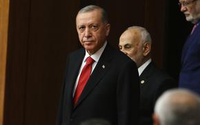 Turkish President Recep Tayyip Erdogan joins legislators elected to the Grand National Assembly of Turkey in the May 14 parliamentary elections and attend their first parliamentary session to take the oath, in Ankara, Turkey, Friday, June 2, 2023. Turkish President Recep Tayyip Erdogan's ruling Justice and Development Party and its nationalist and Islamist allies have a majority in the 600-seat parliament, having won a total of 323 seats. Erdogan, who won a runoff presidential vote on May 28, formally starts his third presidential term following a ceremony on Saturday. (AP Photo/Ali Unal)