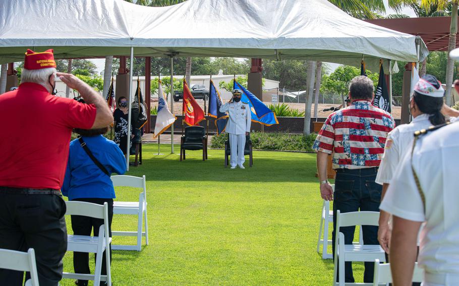 Audience members render honors during a National POW/MIA Recognition Day ceremony at the Defense POW/MIA Accounting Agency facility on Joint Base Pearl Harbor-Hickam, Hawaii, Friday, Sept. 17, 2021.