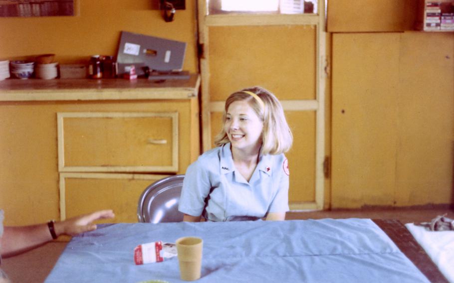 A "Donut Dolly" now identified as Gwen Hejl Roussel, shown visiting the regional forces camp in the village of Dong Xoai in 1971. 