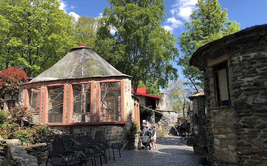 Vogelburg’s “castle complex” includes a maze-like path of buildings made from local stone, giving birds their own homes. Several of the buildings have doors, ornaments and other recycled elements of demolished homes.