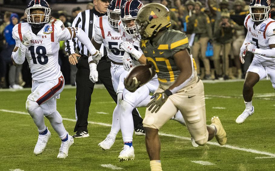 Army running back Markel Johnson runs past the Navy defense for a touchdown during the 2022 edition of the service academies’ rivalry game in Philadelphia.