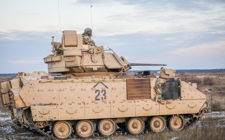U.S. soldiers maneuver an M2 Bradley Fighting Vehicle during a live-fire exercise at Bemowo Piskie, Poland, on Nov. 18, 2022. 