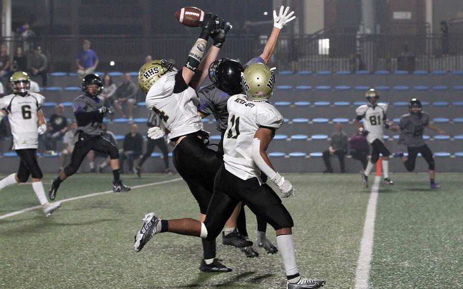 Humphreys' Manny Lawson and Ethan Elliott battle Osan's Kyle Foerst for the ball.