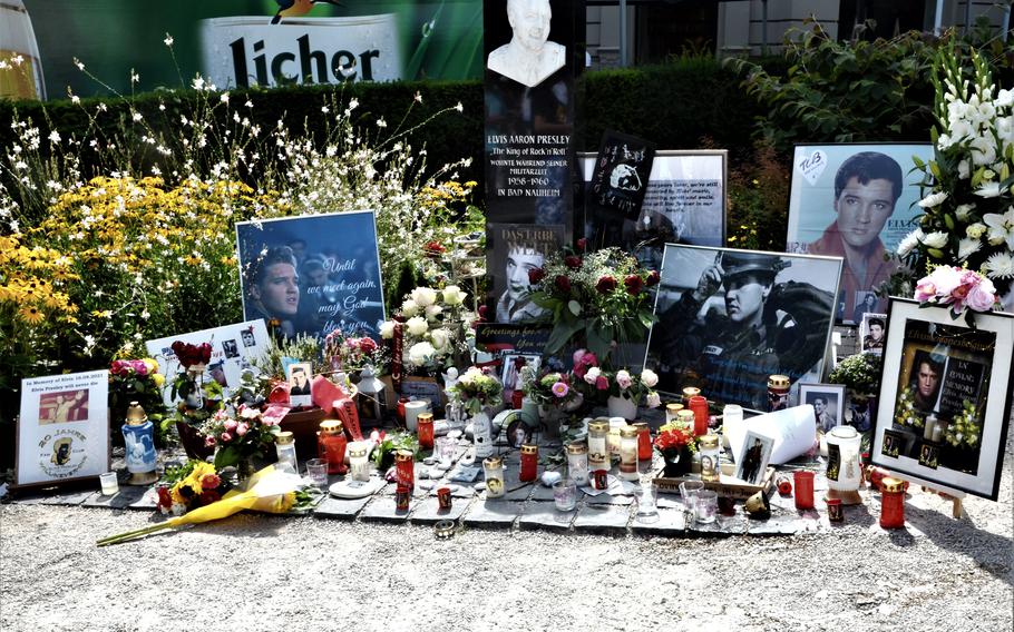 Flowers, candles and photos of Elvis Presley stand at Elvis-Presley-Platz in Bad Nauheim, Germany, Aug. 15, 2021. The town, where the American rock 'n' roll star lived from 1958-1960, holds a festival in Presley's memory in August. 