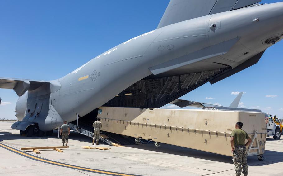 U.S. Marines load a boxed-up MQ-9 Reaper drone onto a cargo plane en route to the Middle East, in a photo released by Marine Corps Forces Central Command on Aug. 12, 2023. The U.S. approved the sale of nearly $4 billion in attack drones, Hellfire missiles and laser-guided bombs to India, as the Biden administration looks to chip away at the country’s long-time defense ties with Russia.