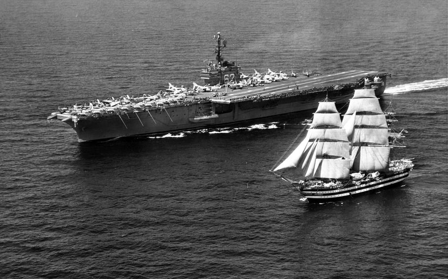 The Italian navy training ship Amerigo Vespucci Sails past USS Independence in the Mediterranean Sea, July 12, 1962.