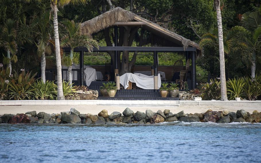 Sheet-covered furniture in a gazebo on Little St. James island is seen on July 10, 2019, a few days after Epstein's arrest. 