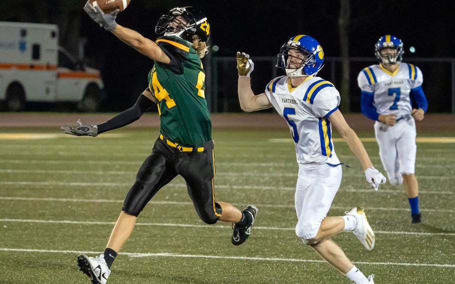 Robert D. Edgren's Parker Kuns stretches for the ball ahead of Yokota's Michael Kasten.