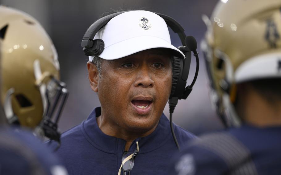 Navy head coach Ken Niumatalolo talks to his players during the second half of an NCAA college football game against Memphis, Saturday, Sept. 10, 2022, in Annapolis, Md. Memphis won 37-13.