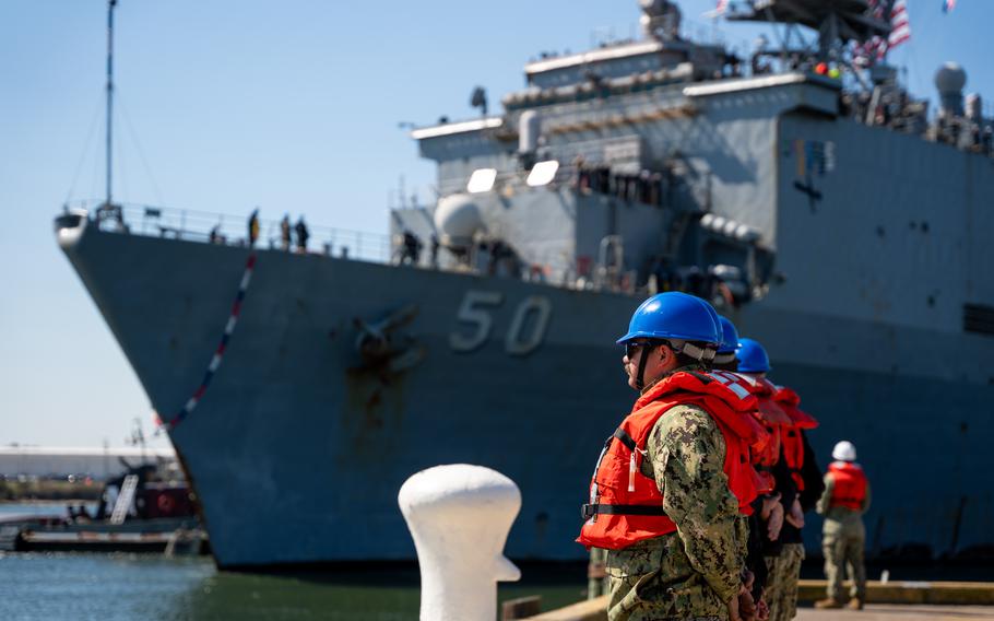 Gunner’s Mate Seaman Michael Vietri, assigned to the Harpers Ferry-class dock landing ship USS Carter Hall (LSD 50), part of the Bataan Amphibious Ready Group (ARG), prepares to handle lines on the pier as the Carter Hall returns to Joint Expeditionary Base Little Creek-Fort Story following an eight-month deployment operating in the U.S. 5th and U.S. 6th Fleet areas of operation, Thursday, March 21, 2024.