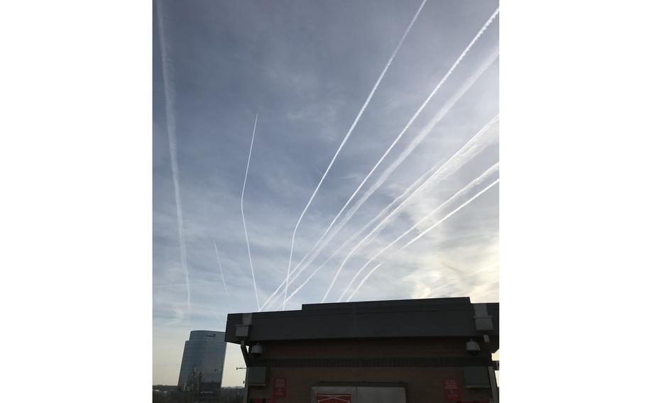 A collection of aircraft contrails in the skies above McLean, Va., in 2019. Contrails, the white clouds that trail behind airplanes, are known by researchers to trap heat from the Earth’s surface in the atmosphere.