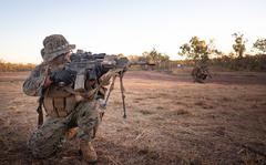 Marines with Company B, 1st Battalion, 7th Marine Regiment, Marine Rotational Force  Darwin conduct an airfield seizure exercise at Mount Bundey Training Area, Australia, July 21, 2021. The exercise used concepts from the Marine Corps' Force Design 2030, which utilizes smaller, more mobile fighting formations.