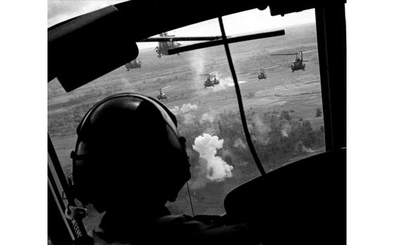 South Vietnam, May 20, 1965:  U.S. helicopters rake the perimeter of a landing zone with rockets and machine-gun fire before dropping off troops brought in from Binh Hoa.   