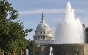 A fountain spouts with the Capitol dome in the background.